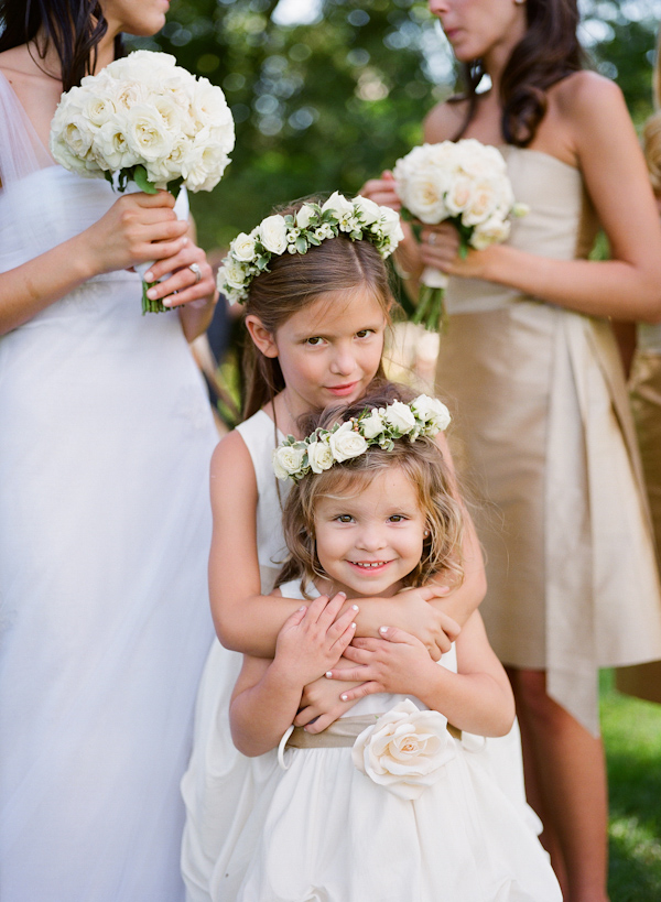 White flower girl dresses and floral hair accessories wedding